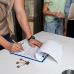A man signs a document